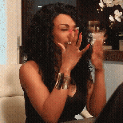 Woman With Red Nails And Ring Covering Mouth GIF