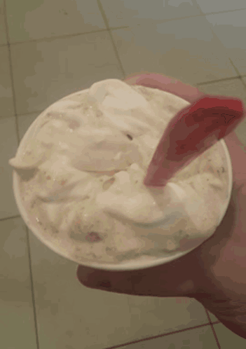 Woman With Red Nails Holding Ice Cream GIF