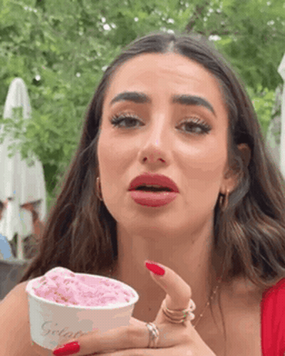 Woman With Red Nails Holding Ice Cream GIF