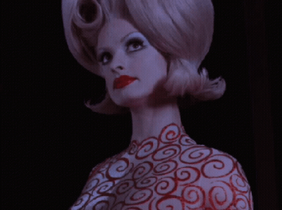 Woman With Red Swirls On Body And Hair GIF