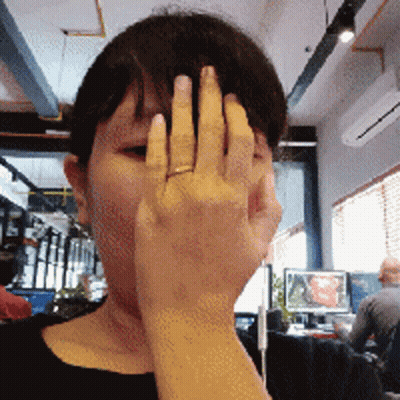 Woman With Ring Covering Face GIF