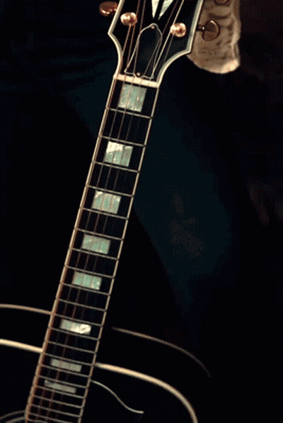 Woman With Ring Playing Electric Guitar GIF