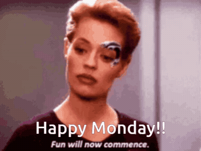 Woman With Robotic Eye Saying Happy Monday GIF