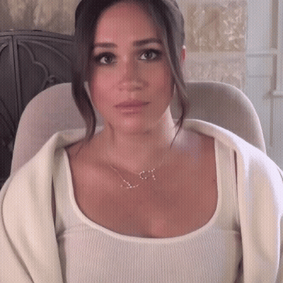 Woman With S Necklace Sitting In Chair GIF