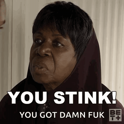 Woman With Scarf Saying You Stink GIF