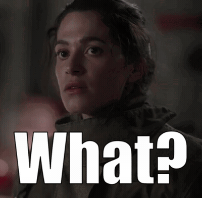 Woman With Serious Look Next To What GIF