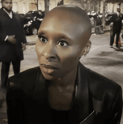 Woman With Shaved Head And Nose Ring GIF
