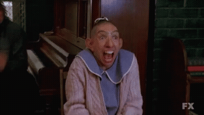 Woman With Shaved Head Making Funny Face GIF