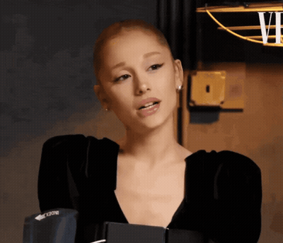 Woman With Shaved Head Wearing Black Vogue Top GIF