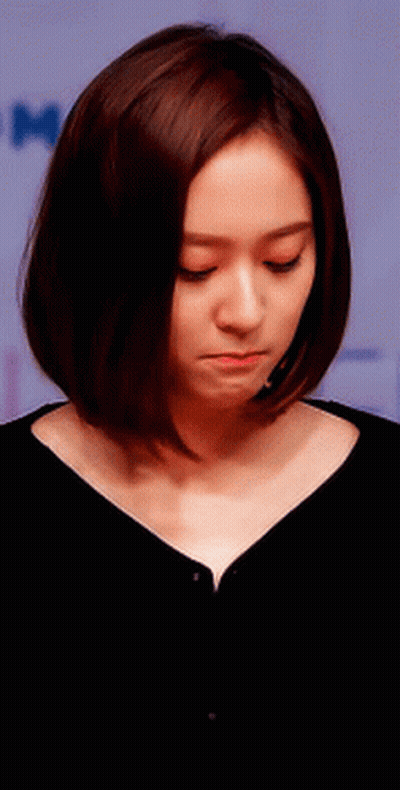 Woman With Short Brown Hair Looking Down GIF