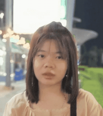 Woman With Short Hair Looking At Camera GIF