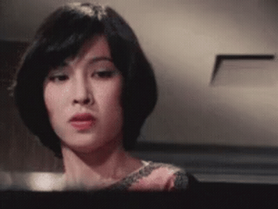 Woman With Short Hair Looking At Camera GIF