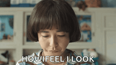Woman With Short Hair Making A Face Saying How Feel I Look GIF