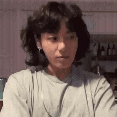 Woman With Short Hair Wearing Headphones Making Face GIF