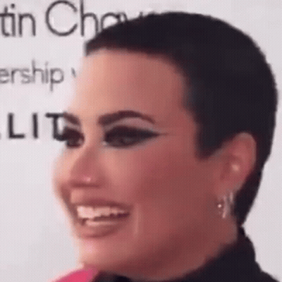 Woman With Short Haircut And Earrings GIF