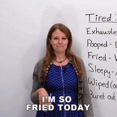Woman With Sign Saying Tired Exhausted Pooped Fried Sleepy Wiped Burnt Out GIF