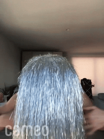 Woman With Silver Tinsel Hair And Comeo GIF
