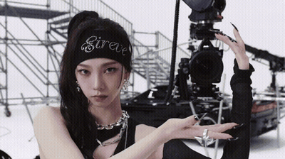 Woman With Sireve Headband Facing Camera GIF