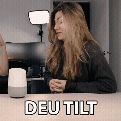 Woman With Smart Speaker Saying Deu Tilt GIF