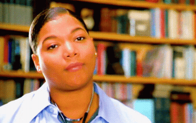 Woman With Stethoscope In Front Of Bookshelf GIF