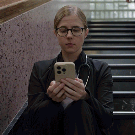 Woman With Stethoscope Looking At Phone GIF