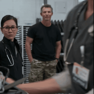 Woman With Stethoscope Standing In Front Of Man GIF