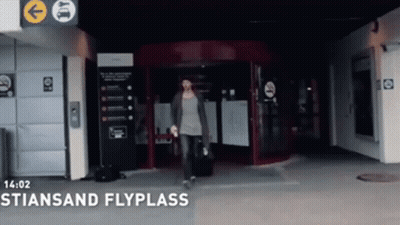 Woman With Suitcase Enters Stiensan Flyplass GIF
