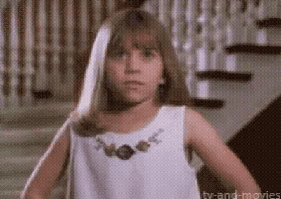 Woman With Sunglasses And Earbuds Asking How You Doin GIF