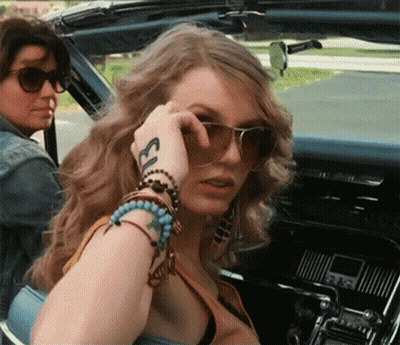 Woman With Sunglasses And Ecl Tattoo On Wrist GIF