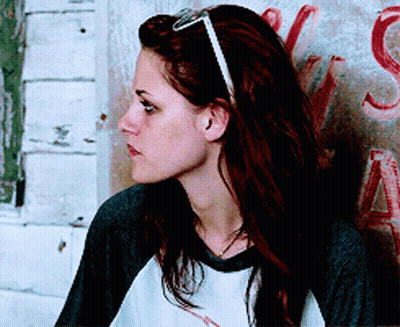 Woman With Sunglasses And Headband Leaning Against Wall With Letter S GIF