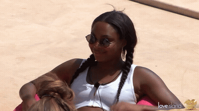 Woman With Sunglasses And White Tank Top On Love Island Float GIF