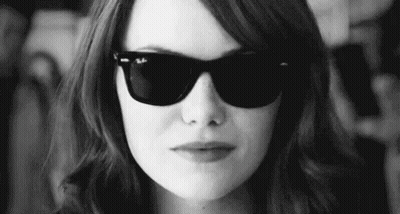 Woman With Sunglasses Making Funny Face Black And White GIF