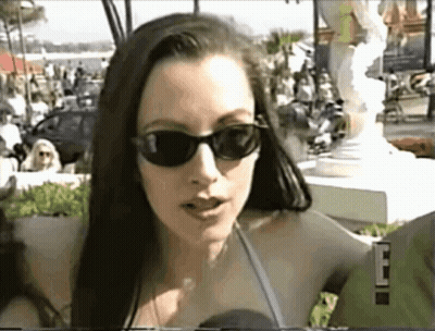 Woman With Sunglasses Talking Into Microphone 'E GIF