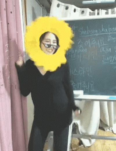 Woman With Sunglasses, Yellow Hat, And Shabang Blackboard GIF