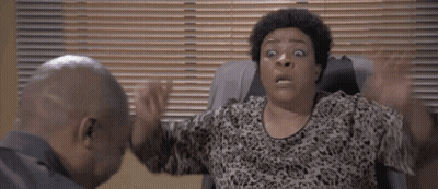 Woman With Surprised Look Sitting GIF