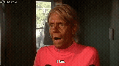 Woman With Tan On Face And Pink Shirt GIF