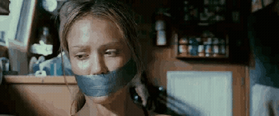 Woman With Tape On Mouth Talking On Phone GIF