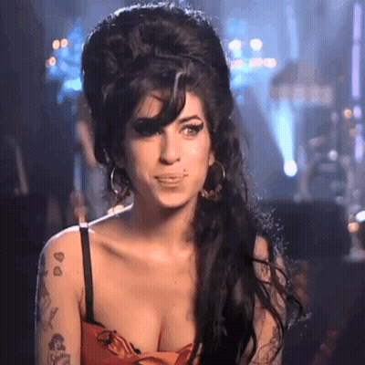 Woman With Tattoo In Red Dress Big Hairdo GIF