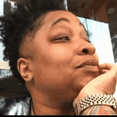 Woman With Tattoo Making Funny Face GIF