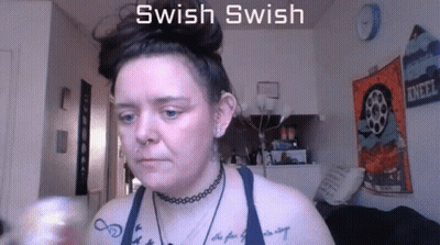 Woman With Tattoo Saying Swish Swish GIF