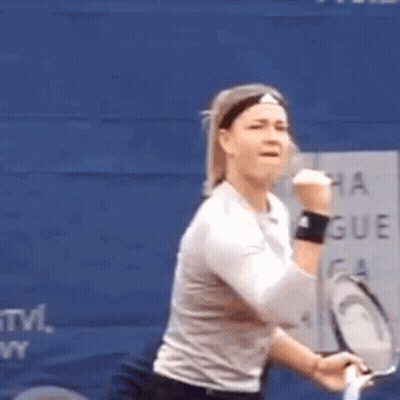 Woman With Tennis Racquet At Blue Wall Saying Montreal Group GIF