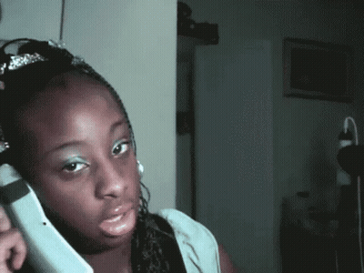 Woman With Tiara Talking On Phone GIF