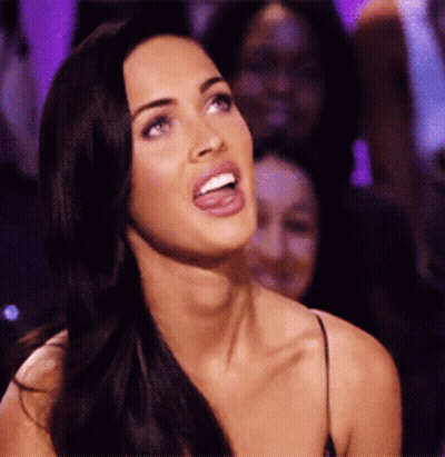 Woman With Tongue Out In Dark Room GIF