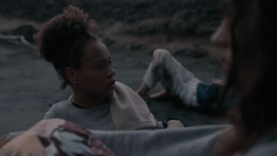 Woman With Towel Looking At Another Woman GIF
