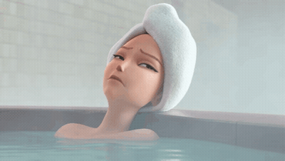 Woman With Towel On Head Laying In Bathtub GIF