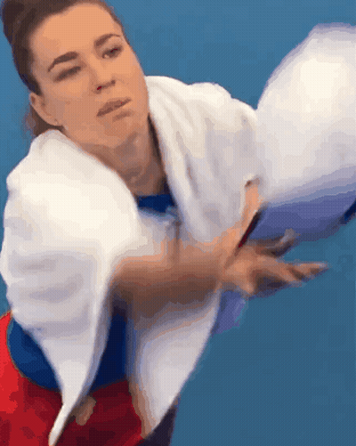Woman With Towel Throwing Tennis Ball GIF