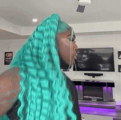 Woman With Turquoise Hair In Front Of Television GIF