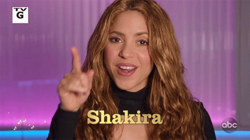 Woman With TV G Logo And Shakira GIF
