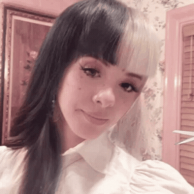 Woman With Two Different Colored Hair Taking Selfie GIF