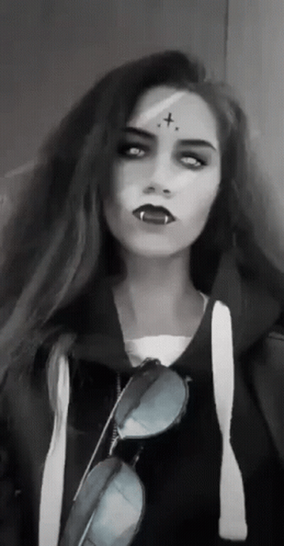 Woman With Vampire Makeup And Sunglasses GIF